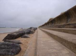 The final preventive action that Happisburgh has taken to prevent the further eroding of the coastline was to create a concrete wall which protects the agriculture land next to their beach (Figure 8).