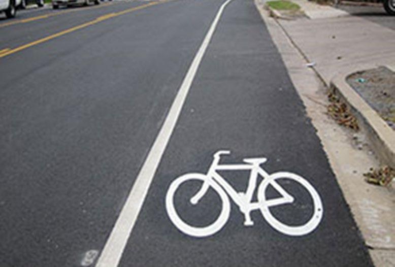 On most streets, bicycle lanes are provided either adjacent to the curb, or between the curbside parking lane and the right travel lane.