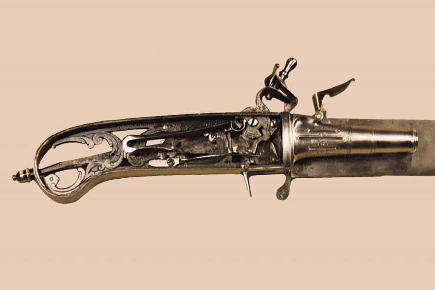 Ca. 1700: Hunting Knife Flint Lock Pistol A flint lock is positioned on the side