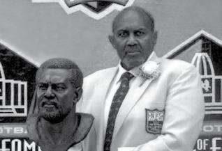 FORMER NFL GREATS Bob Brown (right) became Nebraska s third inductee in the Pro Football Hall of Fame in August of 2004, joining Guy