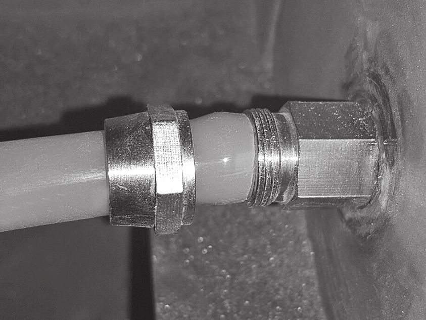 Lock 90 Bulkhead Fitting in place with included Fitting Locknut (FIG 3).