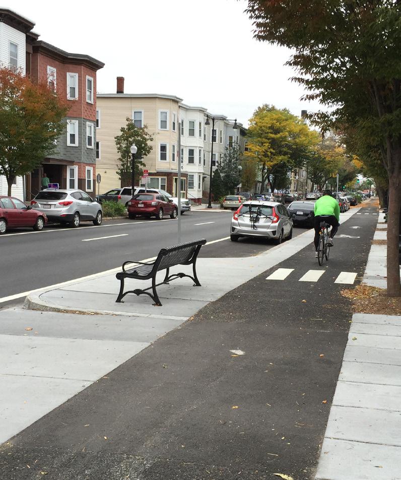 This recommended configuration referred to as a floating bus stop repurposes the street buffer into a dedicated passenger platform between the motor vehicle lane and the bike lane.
