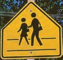 Watch for children crossing the road. 3. Traffic from another lane will enter the road. COMMUNITY CONNECTIONS Find different traffic signs in your community and draw them.