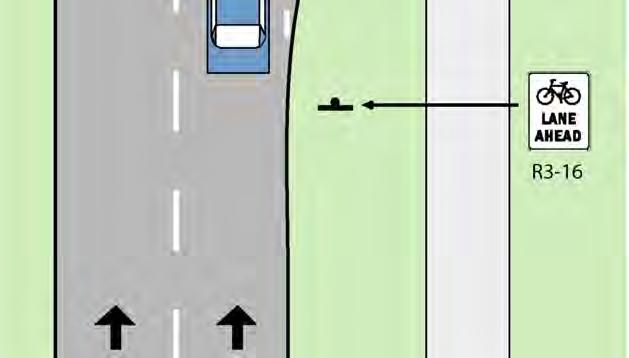 Bicyclists have an option to bike either in the bike lane or along the sidewalk bikeway. 2. The ramp should resemble a curb ramp with flared sides and a flush edge with the road grade.
