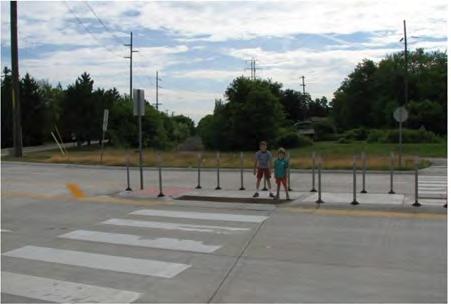 The crosswalks are staggered to direct the pedestrian view towards oncoming traffic. 3.