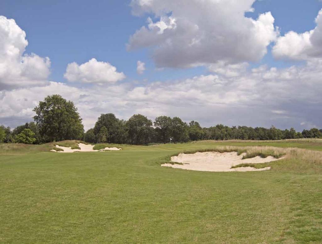 Deep, grassy hollows are located behind the green. Photograph by sense of distance the player has toward the green. Specifically, it leads golfers into the belief that the green is closer than it is.