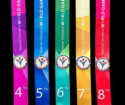 The World Games gold, silver and bronze medals and placement ribbons featured the 19 colors of the World Games logo.