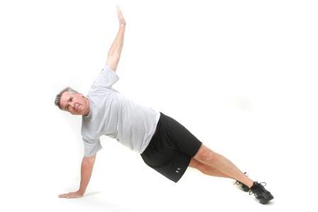T Push Up Start: On your toes and one hand placed a bit wider than shoulder width and