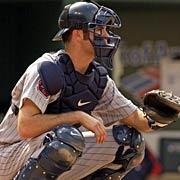 in a relaxed stance (right) Joe Mauer in a relaxed stance (below) READY STANCE (RUNNERS ON BASE/2 STRIKE COUNT) Feet slightly wider than receiving stance heels are on the ground, toes slightly