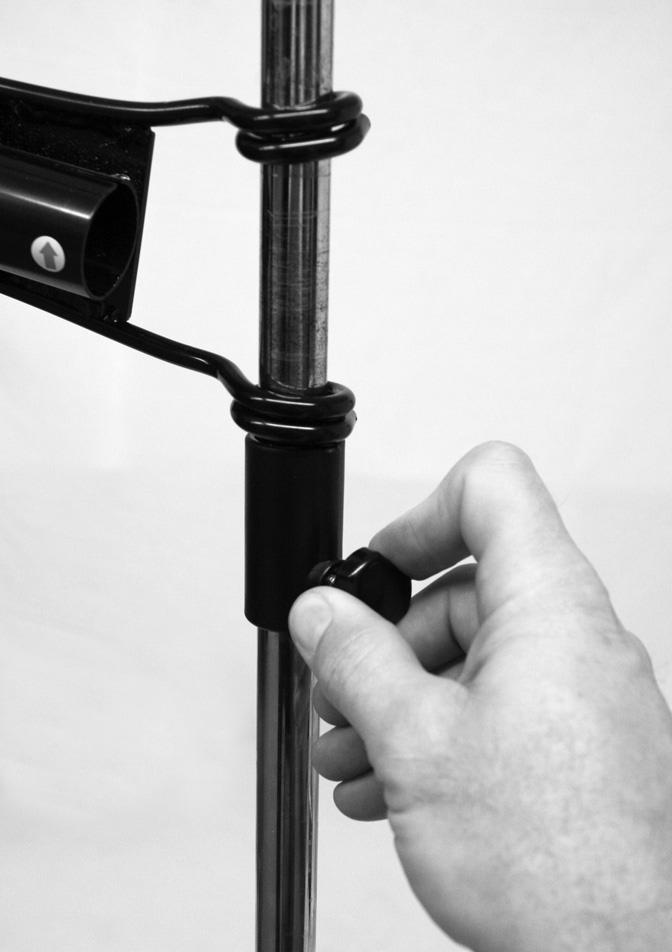 Cap. Figure 7. I Figure 7 5 - To adjust the height of the Batting Stick loosen the knob on the adjustment collar attached to the center pole.