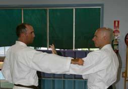 Tori punches with his right hand. Uke blocks shuto and quickly steps in striking shuto.