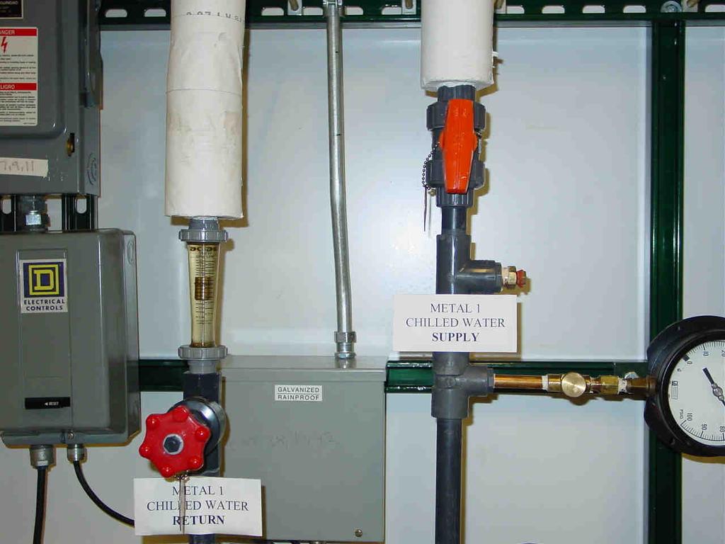 Figure 3 Process Chilled Water Lines 19. Pull the main breaker switch for the e-beam power supply up to the ON position. Wait approximately 1 minute to allow the electronics to warm up. 20.