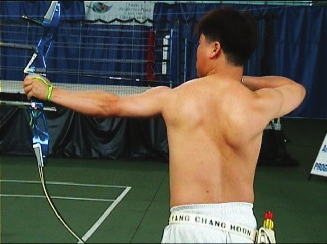 TOTAL ARCHERY 5 _The Shoulders Both shoulders must stay down as much as possible. Refer picture no.11 below. Photo No.