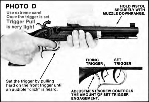 When you are ready to fire, carefully remove the pistol from the loading stand. Hold the pistol firmly, with the muzzle pointed downrange as shown in Photo C.