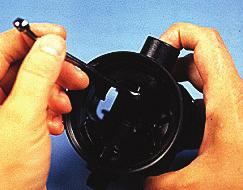 It will be necessary to hold the piston with the tip of your index finger to keep it from rotating.