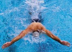 To make the recovery easier, accelerate hard through the fi nish of the arm stroke and then push your face forward and down into the water as your arms recover.