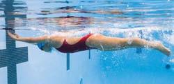 Breaststroke Turn 1. Time your last stroke so that your body is fully stretched as you reach the wall (Fig. 7-15A). 2.
