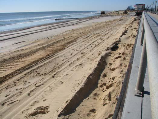 By October 25, 2011, the ACOE project had restored a dry berm seaward of the rock revetment covering the previously exposed rocks.