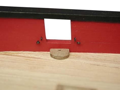 following the camber of the lower edge of the stern fascia (Photo 030). It is recommended that PVA glue be used for fitting the text as this allows plenty of drying time for alignment.