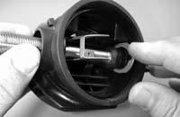 Apply a medium blade screwdriver to the slotted head of the orifice inside the air barrel, and turn it clockwise while closely watching the lever.