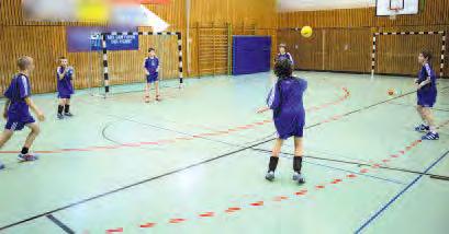 Passing and Catching Bounce passes through a hoop to the partner Passing and catching in a circle Direct passes of two balls at the same time Two attackers are passing a ball to