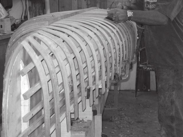 A finished edge can be applied to the ribs with a 1/2-inch radius router bit. The prepared ribs are soaked several days before they are steam-bent.