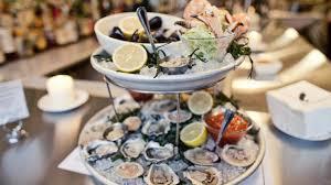 Oyster Bar Serving A Selection of Oysters Professionally Shucked Accompanied by a Selection of