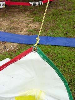 Step 9: Untie the end of the spinnaker halyard that you