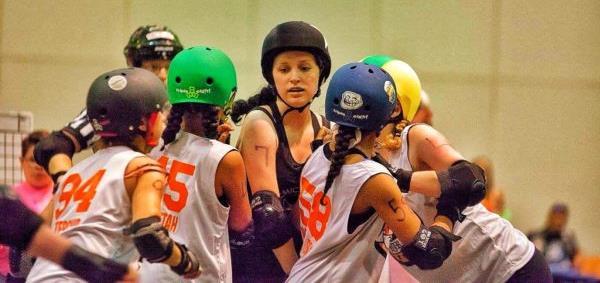 blockers to remove them from her path. There are constant collisions whether it be the jammer pushing through or her blocker hitting an opposing blocker out to help her through.