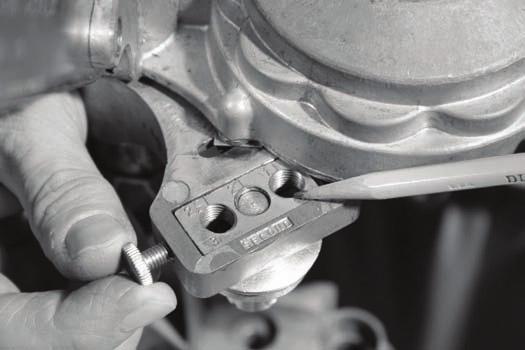 The Second Seam Roller (left side of sealer head) Rotate the crank until a 2 appears in the indicating window.
