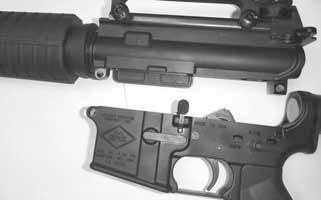 ) Slide the charging handle back into the receiver, ensuring it is locked in place. The bolt should be now locked to the rear. Inspect the chamber to ensure it is empty.