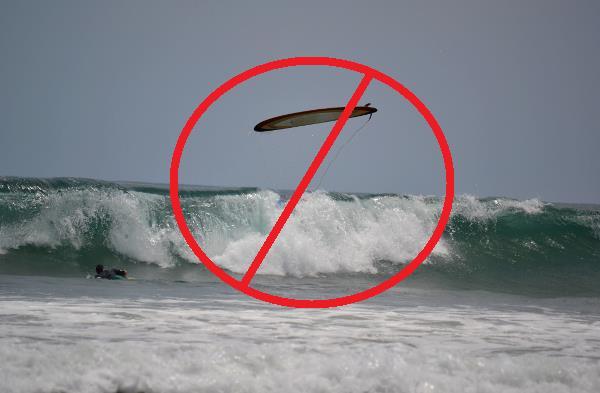 Rule #3 Don t ditch your board When paddling out, don t let go of your board to dive under waves. Loose boards are a major hazard in the water to yourself and other surfers.