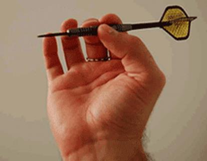 A relaxing and firm grip is needed. You should hold the dart as if it is a potato chip. Do not press it hard before releasing. It is a bad practice to keep your free fingers very close to the dart.