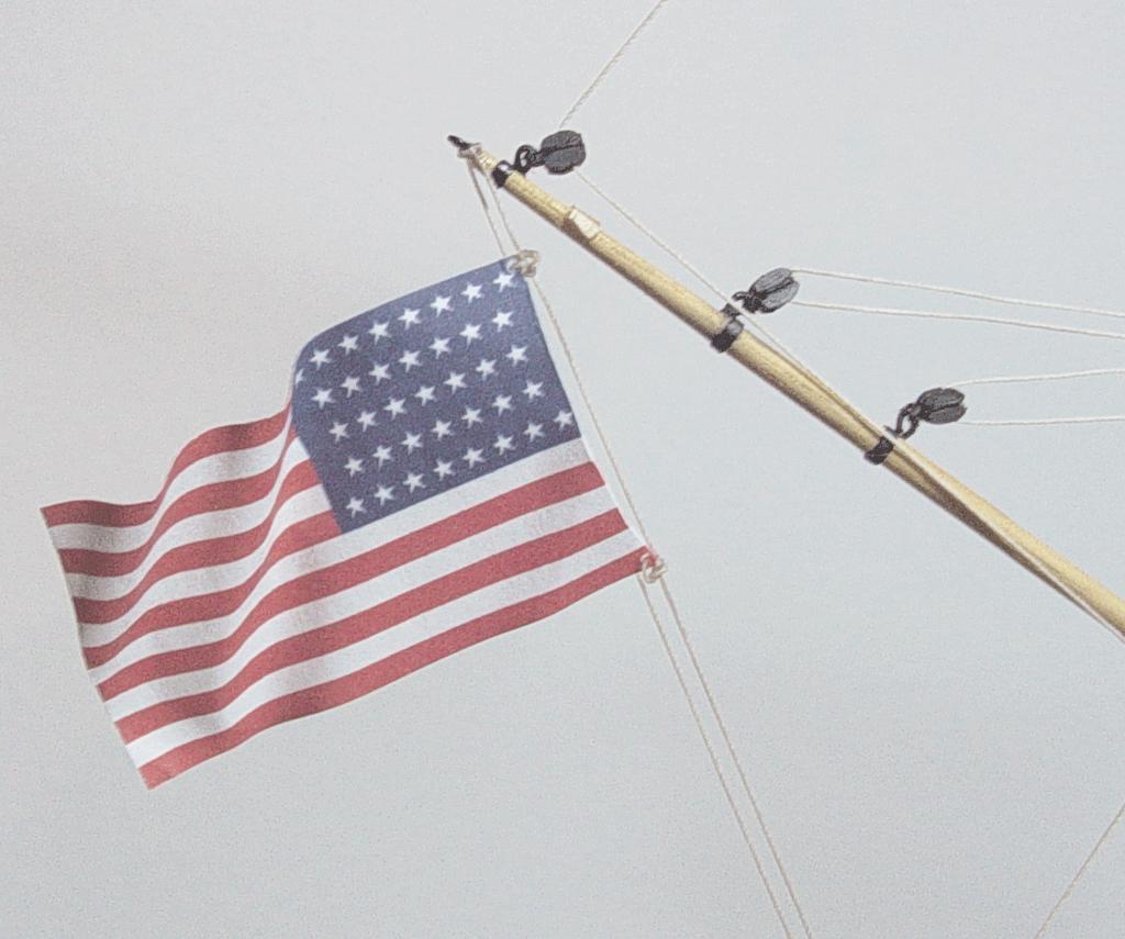 It wasnt necessary to do this to the 37 Star American Flag. It will be seized to the peek lines at the stern. The peek lines are already at an angle and as such, do not require the flag to be.