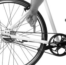 Carefully turn your ebike upright (the rear wheel will not be fully secure) and locate the tension marker on the frame