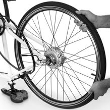 Attaching the rear wheel Place the frame upside down on a flat surface, resting on the saddle and the