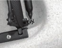 Leave the screw a little loose so that you can run the steering line underneath the screw head.