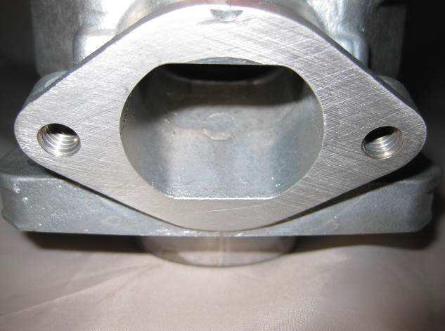 5.5 Unchanged. 5.6 Unchanged. 5.7 Unchanged. 5.8 The sealing flange for the exhaust socket is machined completely flat.