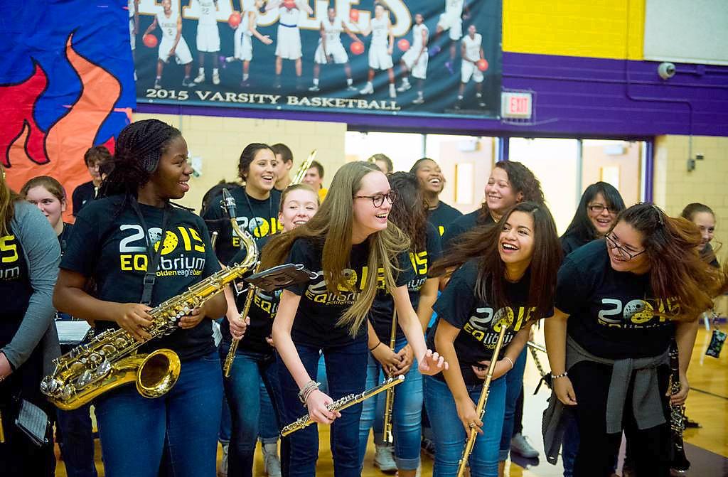 Leaning forward as they dance to the tuba call during the magnet pep rally, sophomore Sydney Ogaga, junior Emma Kilgore and seniors Joseline Hernandez and Ambar Sanchez smile at each other.