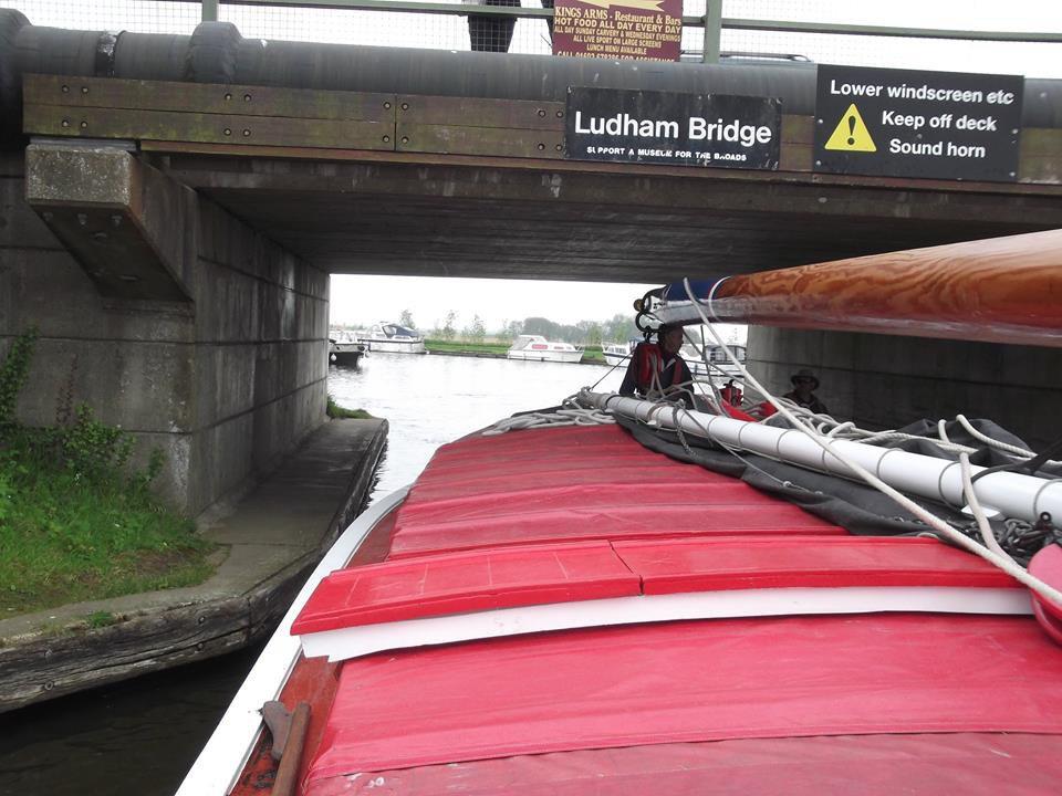 Soon Ludham Bridge came into view, and it was all action, lowering the sail, then the mast, and using the dinghy with an outboard motor, and went through the bridge.