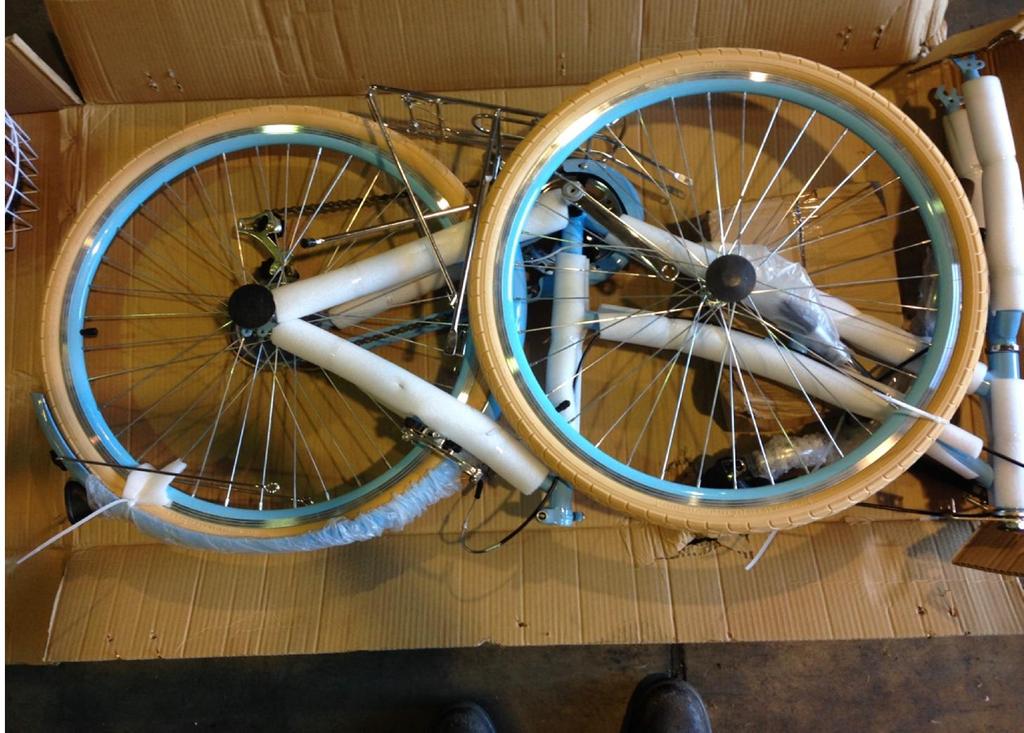 1) REMOVING PACKAGING - Carefully remove all packing material from bicycle and
