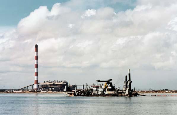 Figure 2. Cutter suction dredger Vesalius, working in front of the North Madras Thermal Power Station. after the development of the Port. Also, approx. 2.5 million m3 of sand from the Outer Port Basin had to be placed in front of the existing beach.