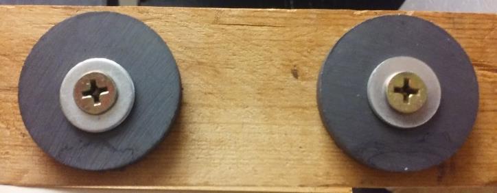 5 cm wide and 4 cm deep to simulate a large body of water (Figure 4). Eighteen ceramic ring magnets 3.2 cm in diameter were placed on both sides of the pool of water 2.7 cm apart (Figure 5).