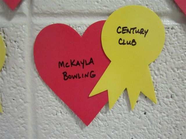 5) Century Club hearts are red with a yellow ribbon. Century Club hearts go on the Heart Wall display just past the participation hearts.