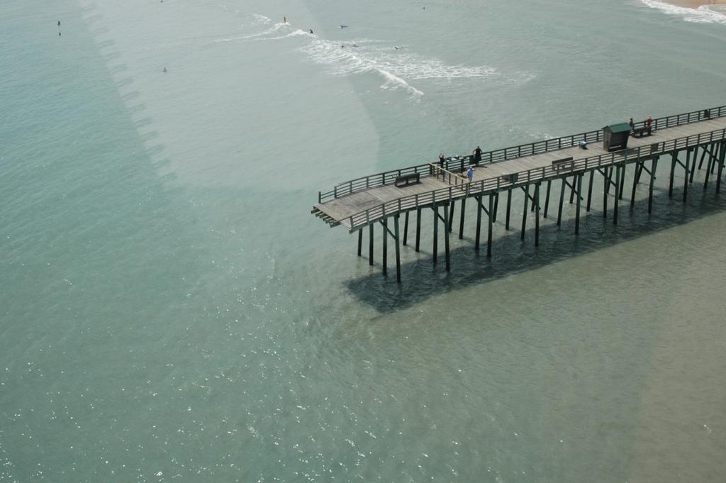 3. The concrete fishing pier constructed over the north jetty at Sebastian Inlet State Park lost about 40 to 50 of the metal breakaway deck grates due to wave uplift forces, but sustained no