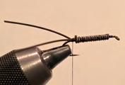 Step 1. Wrap the wire over approximately 80% of the hook shank. Be sure the wraps are tight with no space in between.