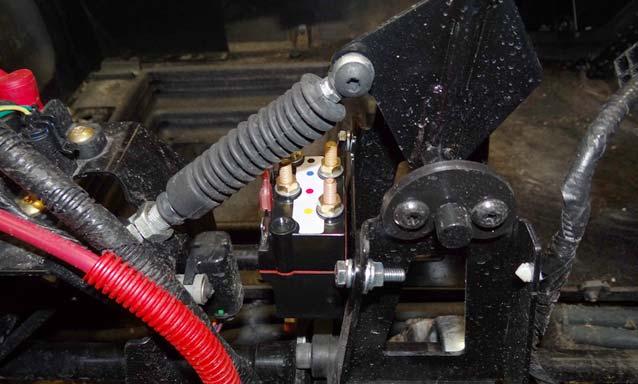 Secure the solenoid assembly to the back of the shift gate using two cap screws, two lock washers, two flat washers, and two nuts. Tighten securely.