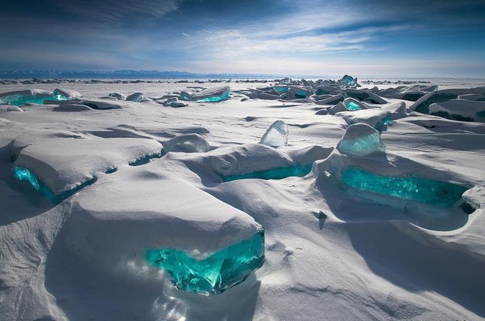 During the 5-hour drive, you will see the wild beauty of the Tajeranskie steppes. After lunch, which consists of Buryat traditional food, you will cross the Olkhon Gates strait by ice.