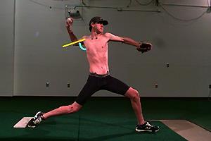 4. At the instant the front foot makes contact with the mound, the throwing arm should be rotated up as shown.