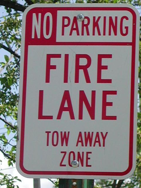 Parking next to the curb in the Fire Zone with signs posted is illegal and carries a